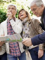 a group of seniors consult a map as they explore NYC