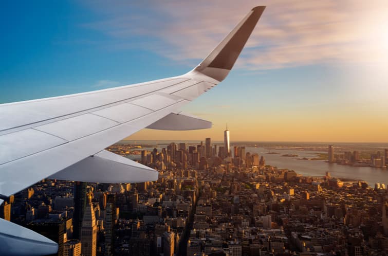 airplane flying over new york city